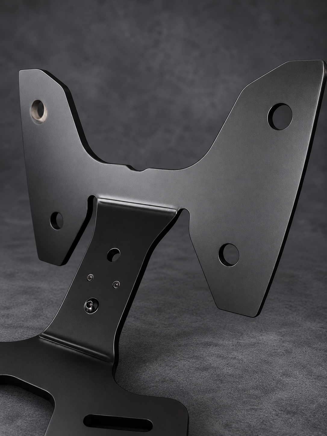 Close-up of a black Cerakote E Series mounting bracket and curved support