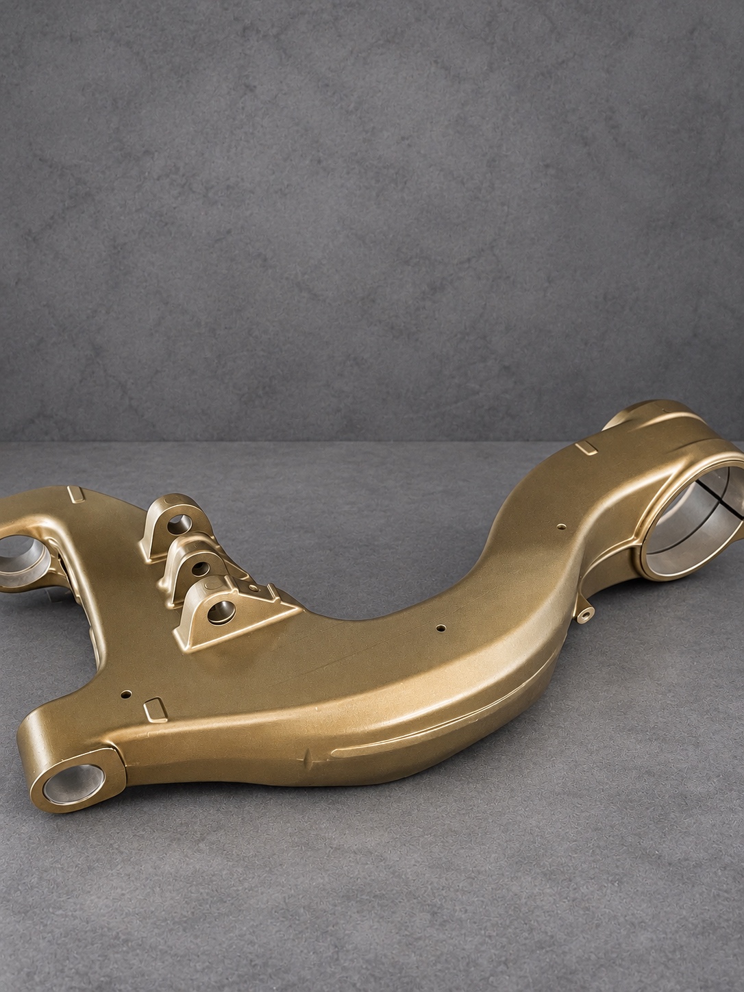 Bronze Cerakote H Series motorcycle swingarm with alloy bores and mounting points