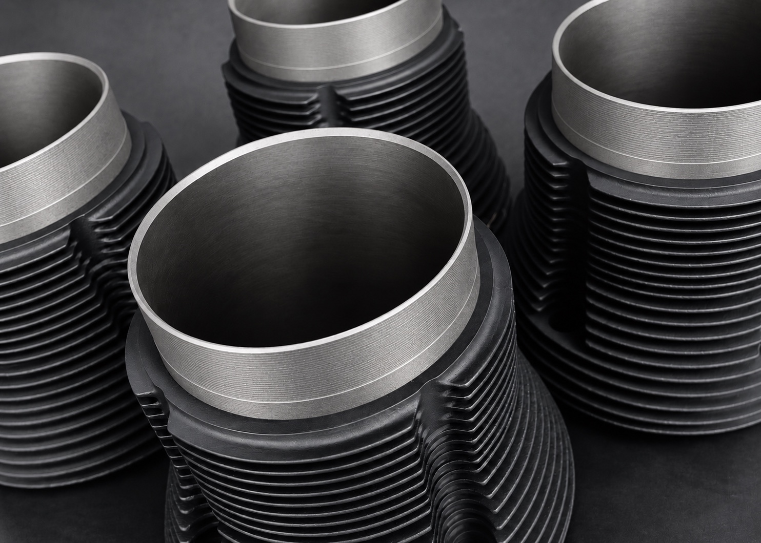 Overhead detail of black Cerakote V Series cylinder fins with exposed machined rims and bores