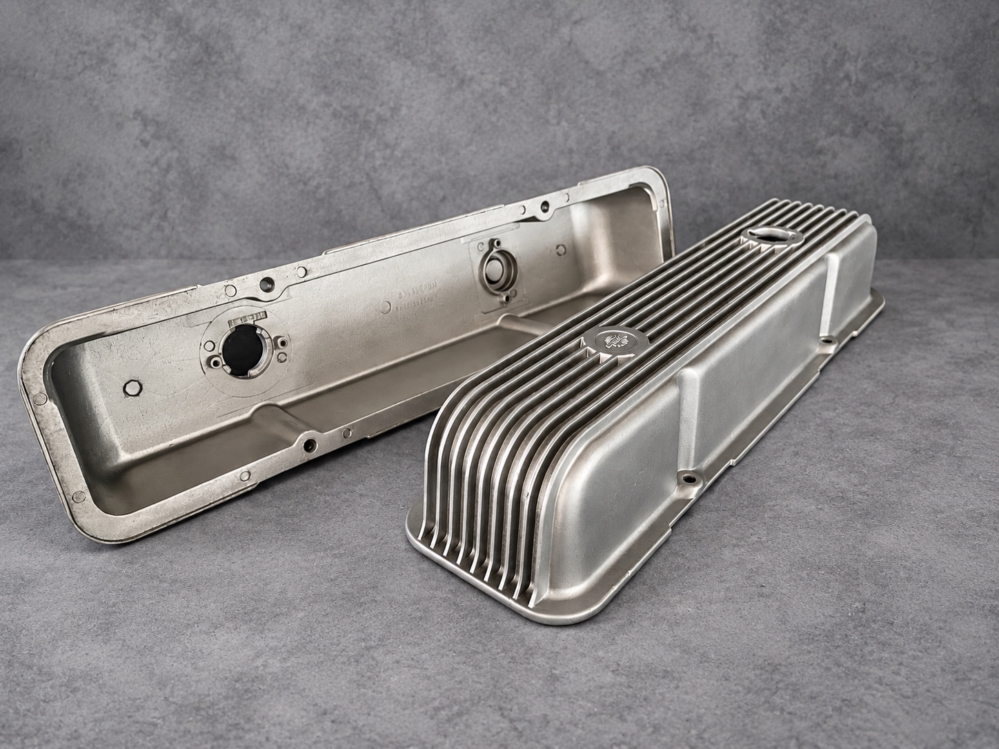 Vapour-blasted rocker covers showing interior and finned exterior surfaces