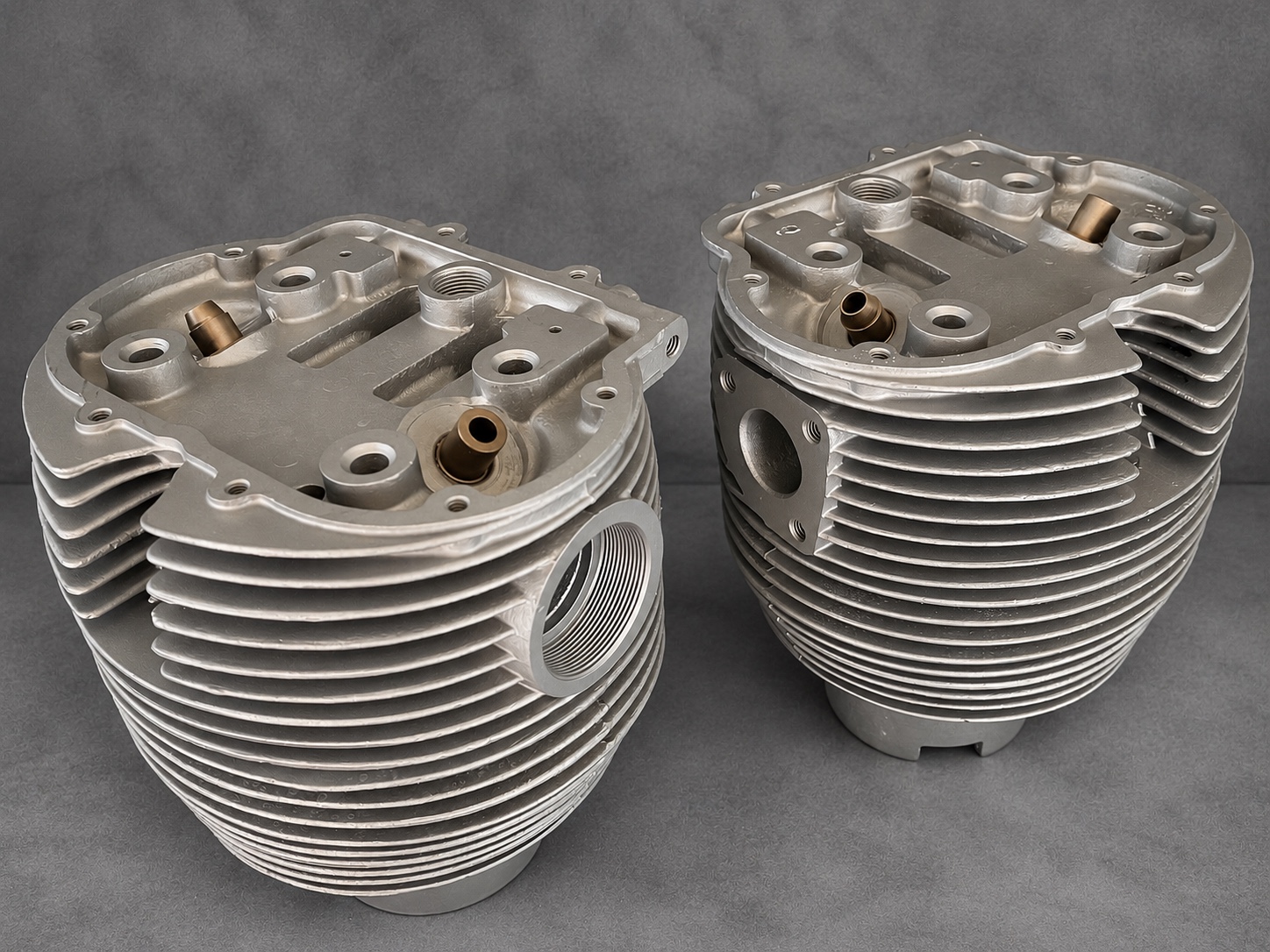 Pair of vapour-blasted finned cylinder and head assemblies